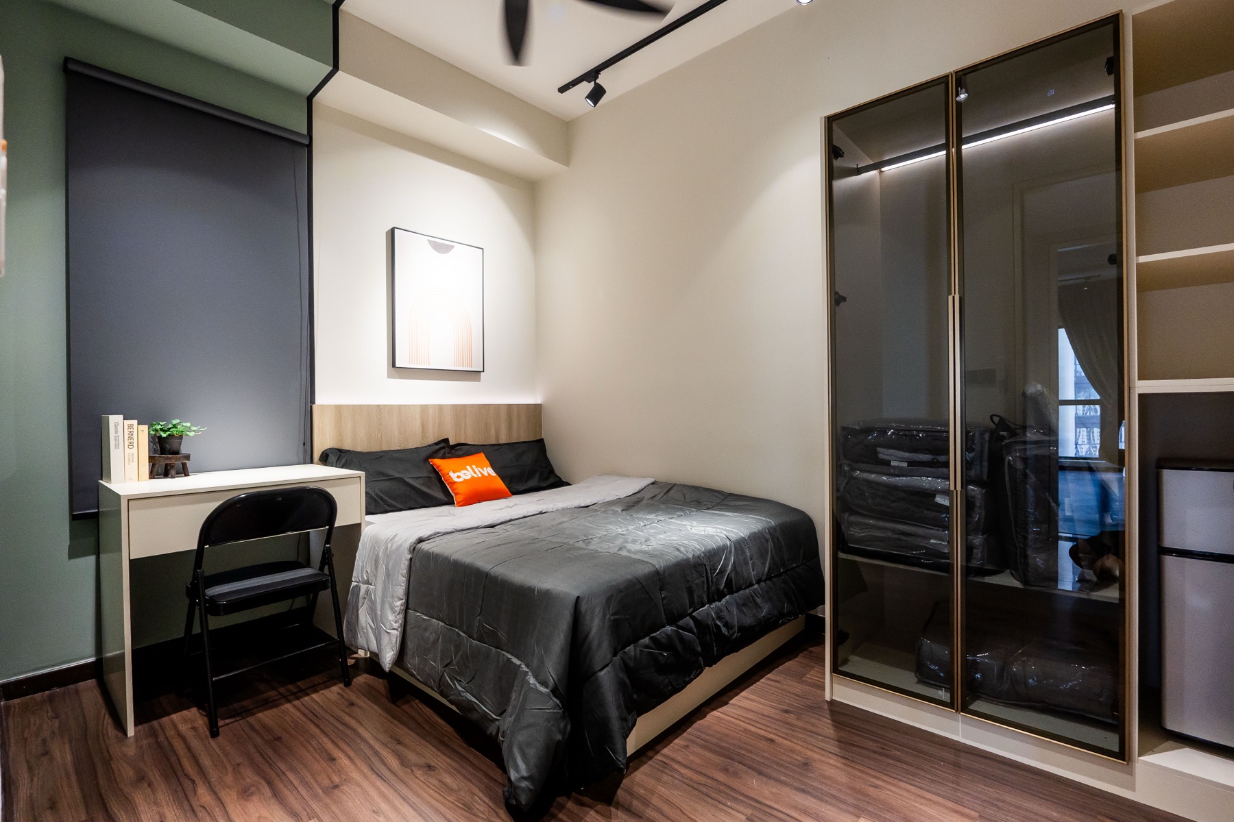 Duta Park bedroom — glass wardrobe, track lighting, dark modern theme