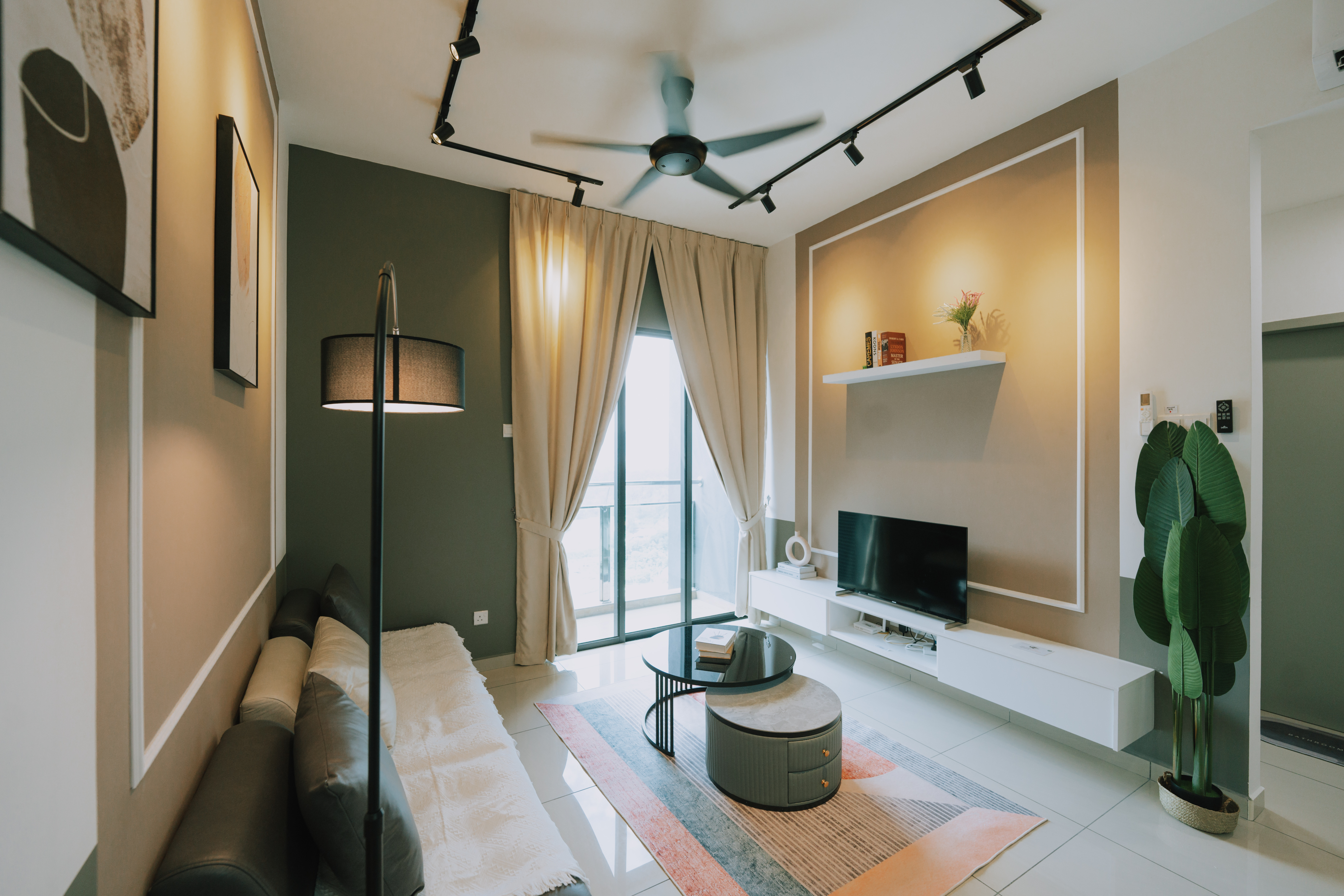 Parkland Residence living room — olive green feature wall, track lighting