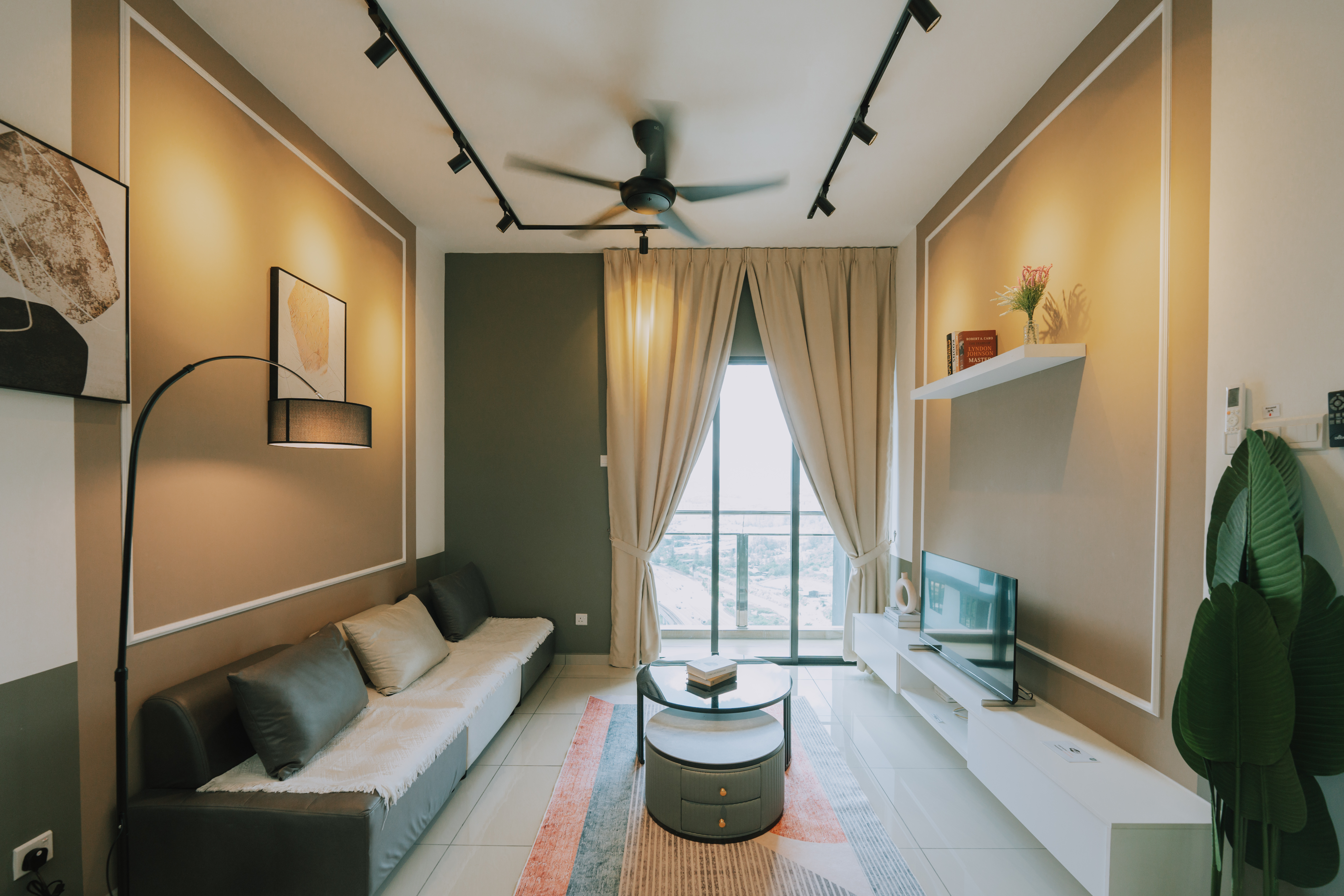 Parkland Residence living room — warm tones, feature wall art